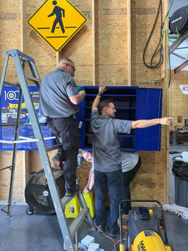 The Blessed Beginnings crew setting up shelves in the shop